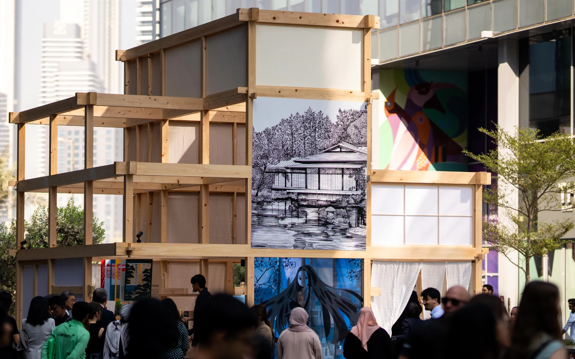 Visitors at a timber pavilion in Dubai Design District during Dubai Design Week 2025