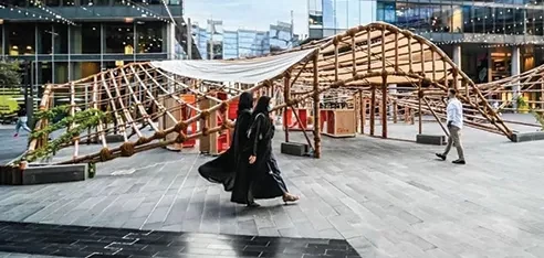 Visitors beneath a timber installation at Dubai Design District during a previous Dubai Design Week