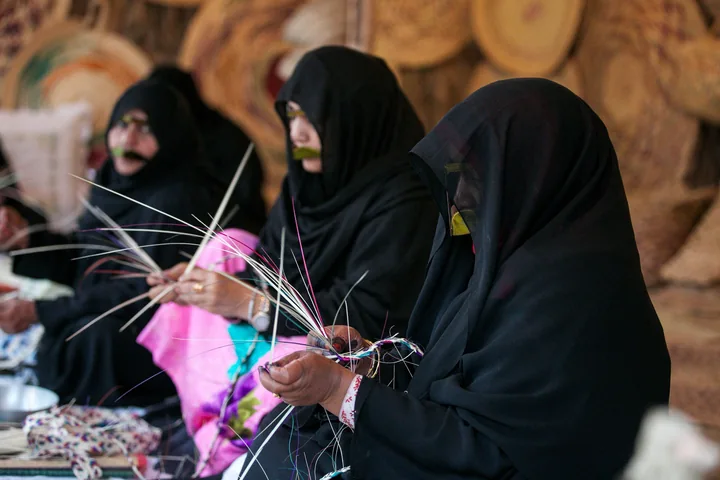 Emirati women making traditional handicrafts at House of Artisans in Abu Dhabi