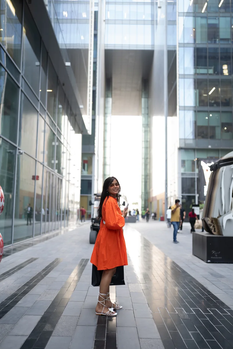 A Design Safari participant among the buildings at Dubai Design District during the 2025 visit